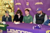 William Kloster, in green shirt, is flanked left to right by brother Jackson, mom Katy, father Will and brother Brady. On Tuesday, the talented Tiger athlete signed a letter-of-intent to attend Cal Poly on a wrestling scholarship.